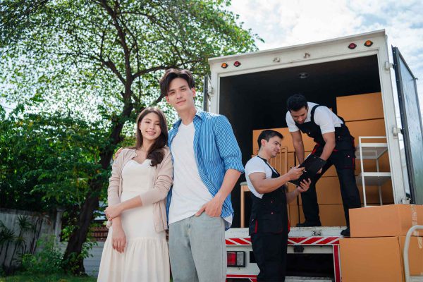 asian-couple-check-while-unloading-boxes-and-furni-2023-11-27-05-02-49-utc